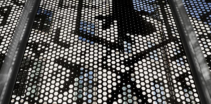 Perforated sheets create a dramatic facade  
