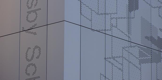 A perforated facade with an artistic element