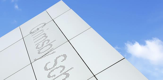 A perforated facade with an artistic element
