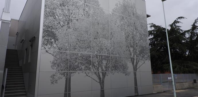 Perforated sheets designed to depict trees