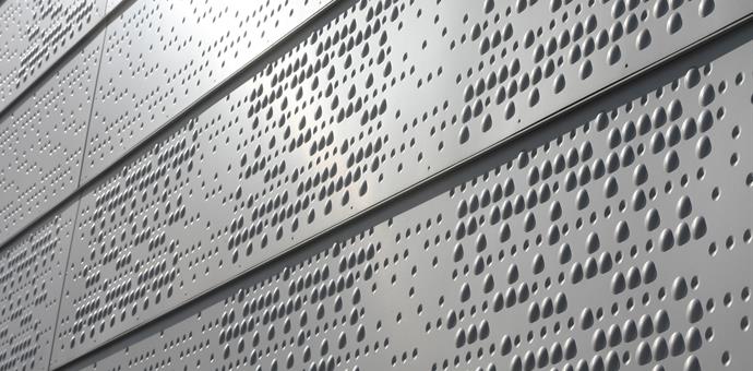 Perforated pattern of concave and convex forms from RMIG used for facade