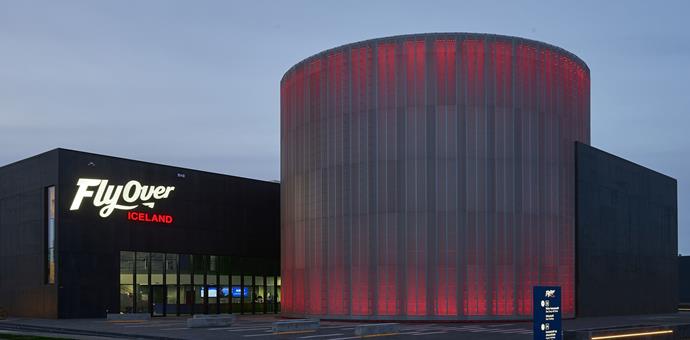 Perforated sheets create a facade for a cylindrical theatre